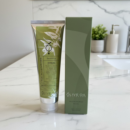 Olive oil facial scrub with packaging on a wooden surface